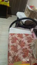 Iron rod bed with mattress.
