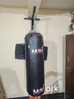 Punching bag with hanger and boxing glove