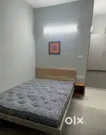 Secure, furnished single rooms with key card entry and community space