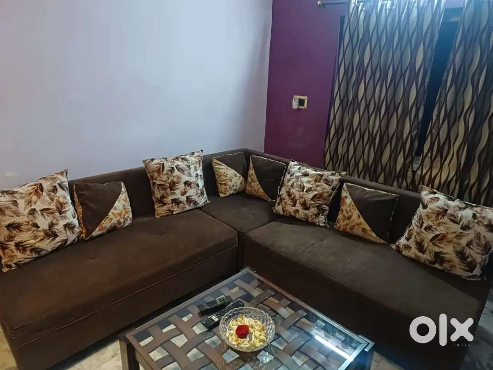 L shaped sofa with cushions