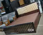 Brand new wooden King size cot with storage.