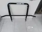 folding wall-mounted pull-up bar, likely from Decathlon's.