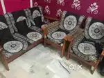 A three seater sofa well mentened price 5000 free sofa cover 3+1+1