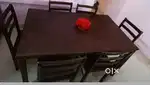 Minimalist brown wooden dining table