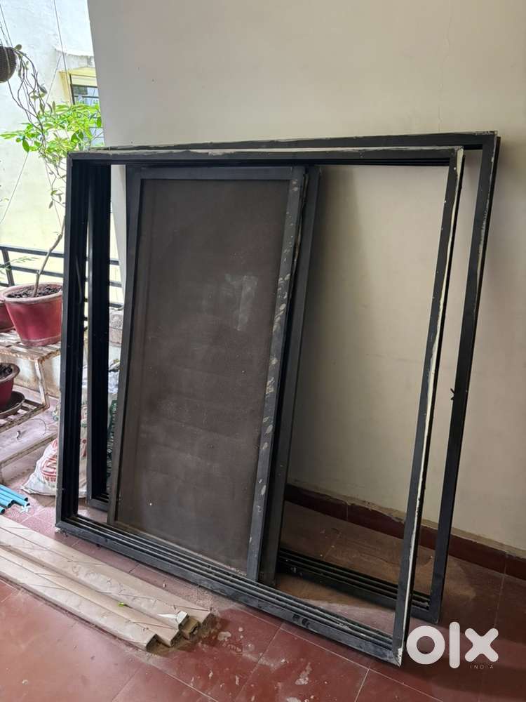 Two, three track window frame size 56 inches by 58 inches
