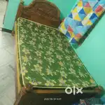 Wooden cot with mattre