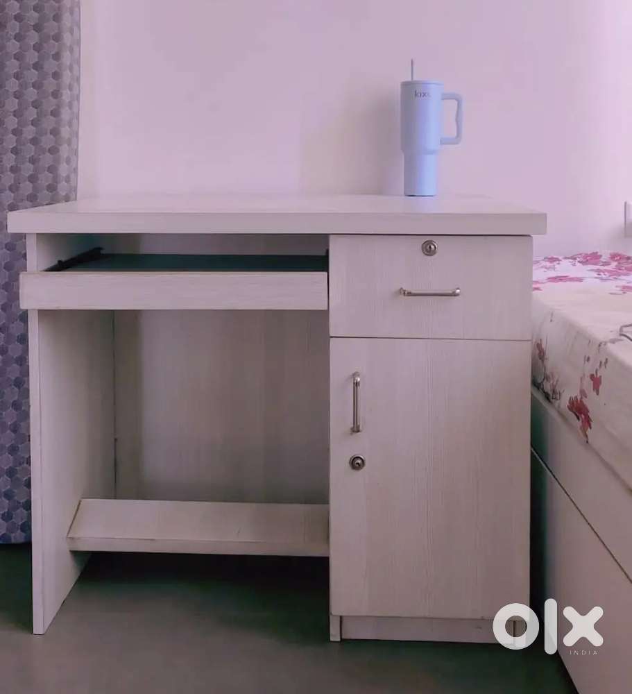 Beautiful white computer table - combines style, space & functionality