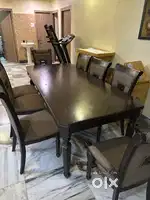8 Seater Wooden Dining Table with cushioned chairs