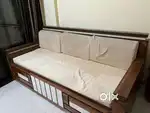 Sofa cum bed with center table