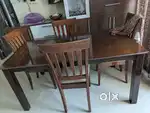 Queen size storage bed and four seater dining table