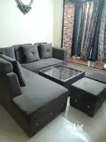 7 seater sofa with two puffies and centre table
