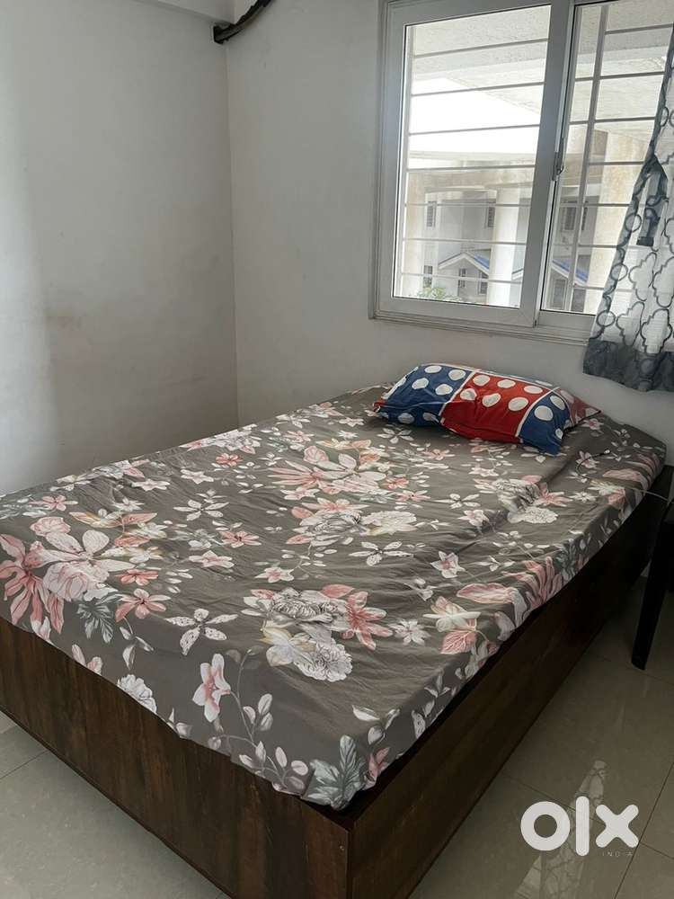 Queen size bed with storage, dressing table and wardrobe