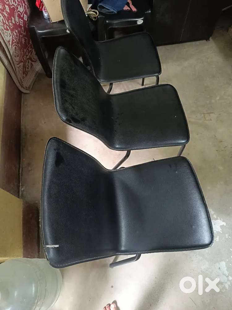 Three black old chairs