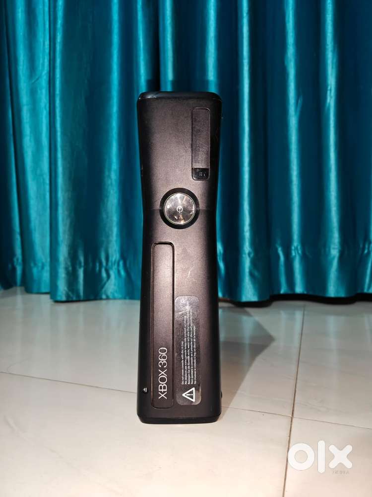 X box 360 with three controllers