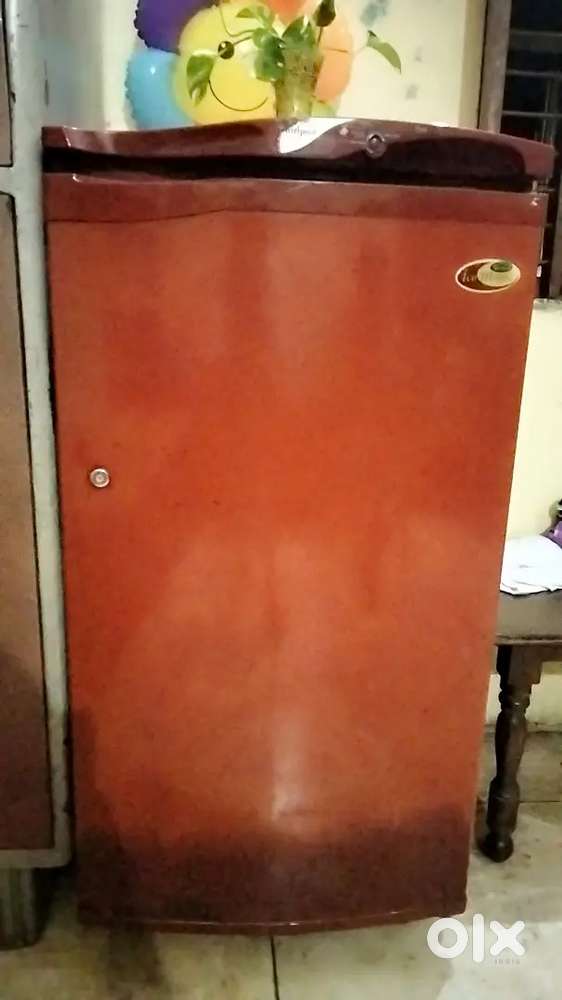 Red colour Whirlpool fridge