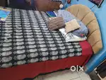 A shegaon wood bed with matress