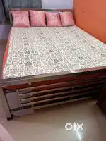 Wrought iron bed with mattress is on sale