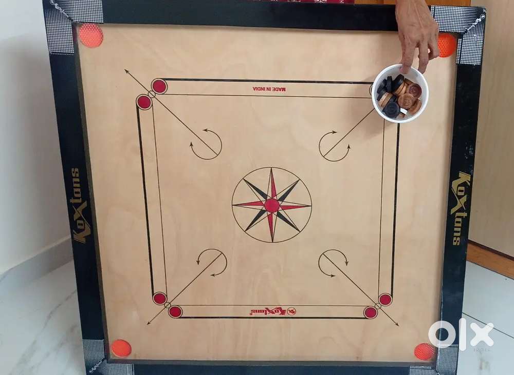 Carrom board and carrom coins powder