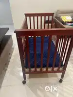 Baby Crib comes with a cot bumper.