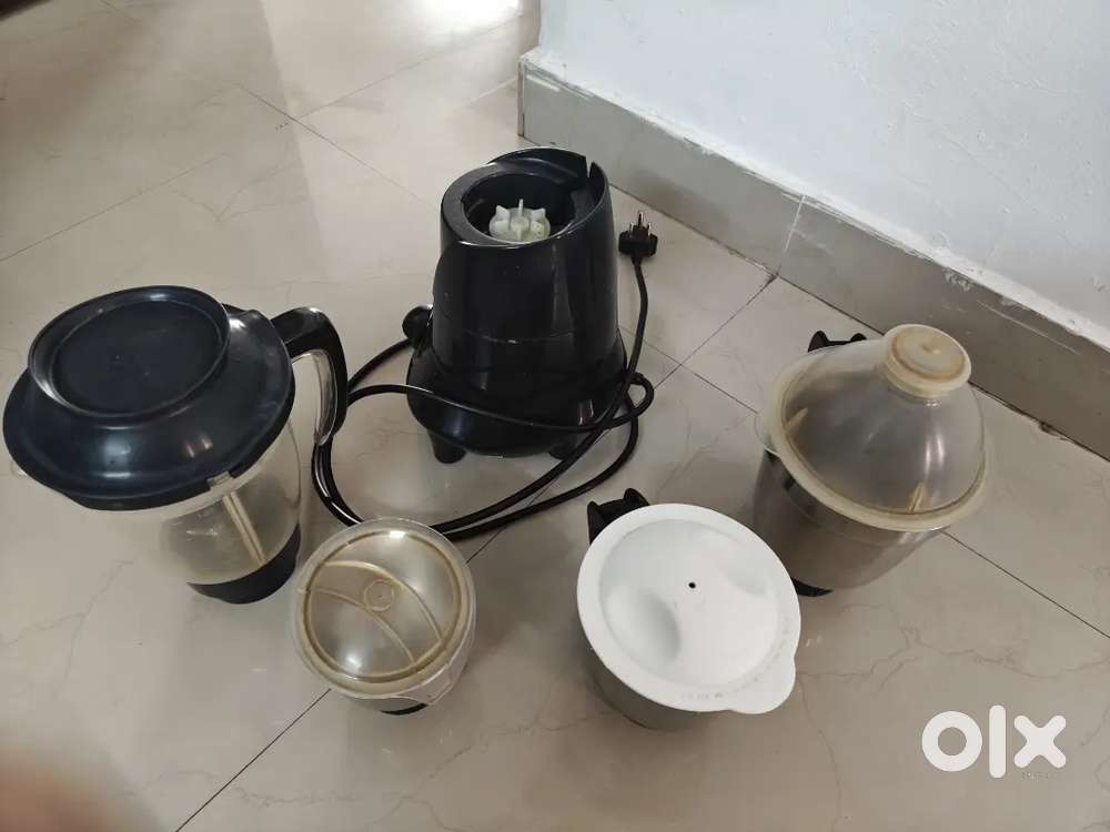 A used mixer grinder with all the jars