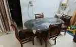 4 Seater Glass top Wodden frame dinning table.