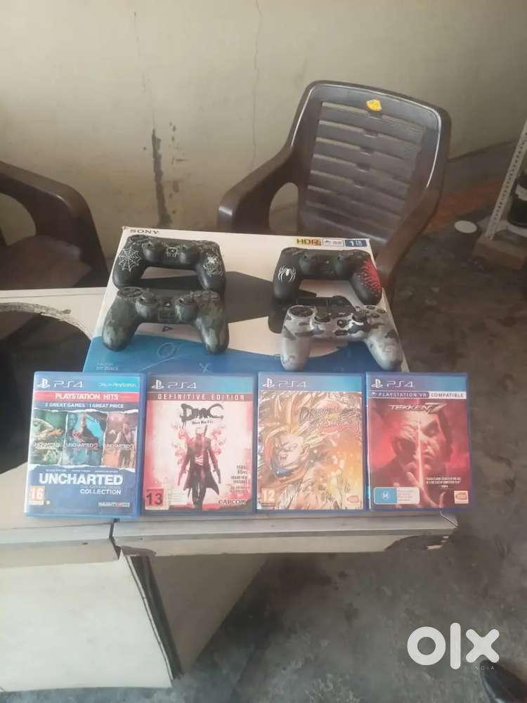 PS4 slim 1 TB with 20+ games and 4 remote control