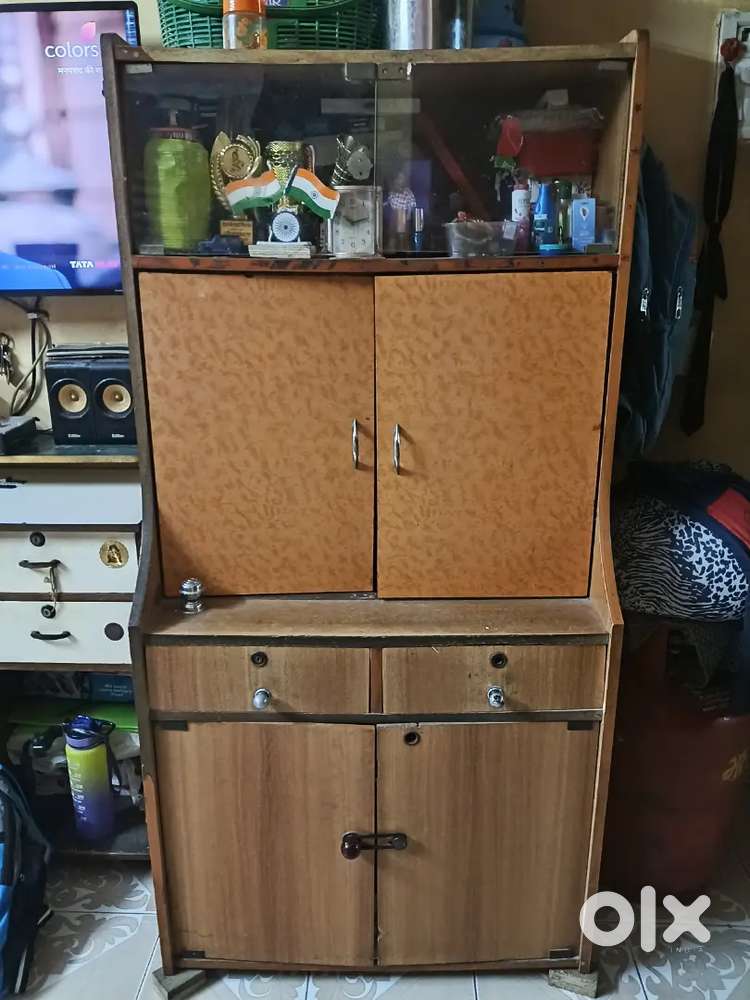 This is a wooden cupboard with(6 doors)4 wooden/2 glasses many storage