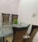 Four seater dining table one year old good condition