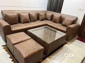 L shape sofa with centre table and 2 puffy
