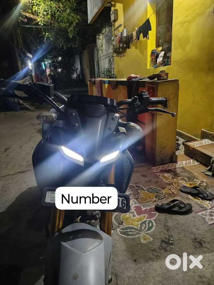 Iam selling my 2022 Yamaha MT-15 V2 in Ice Fluo Vermilion colour.