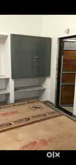 Room with attached kitchen and toilet