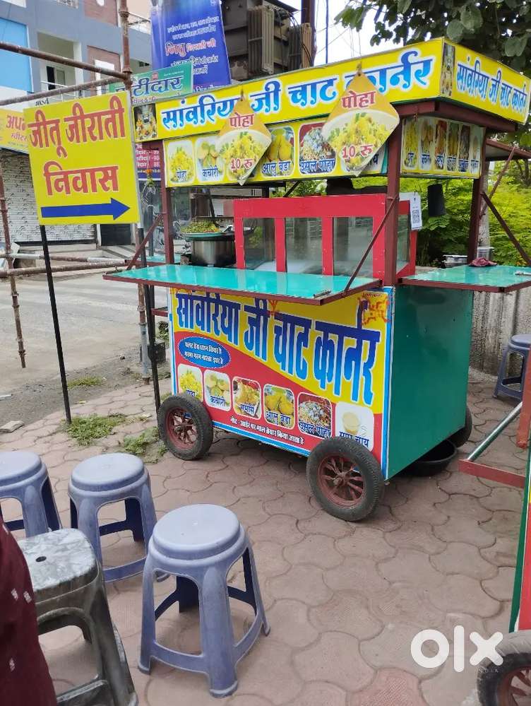 Selling a roadside Food Pushcart.