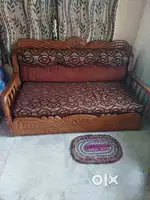 Teak wood sofa cum bed with storage