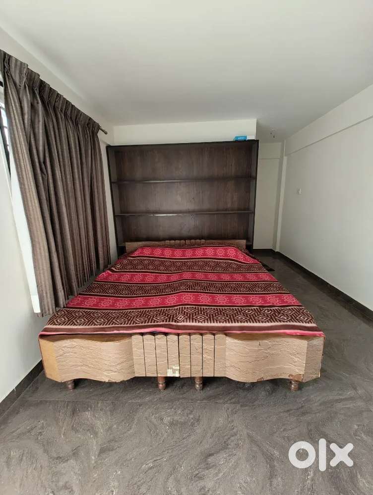 Selling two solid wood single beds in new condition