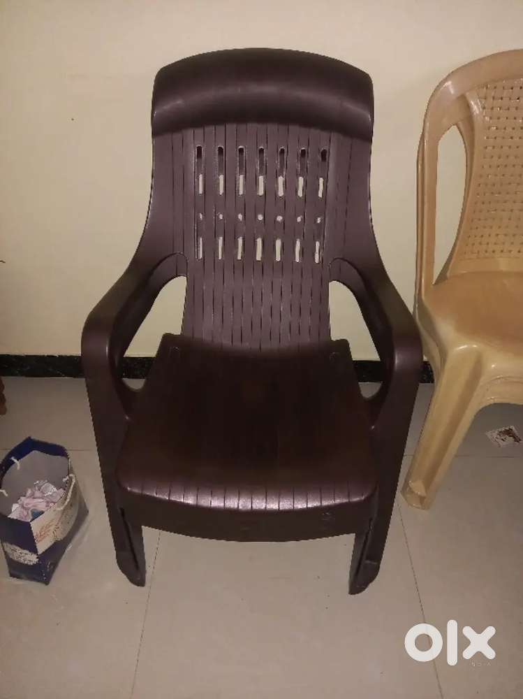 Chairs of different variety and dining table for sal