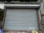 Shop shutter with rotating system