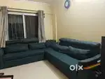 Selling used L shaped sofa with storage