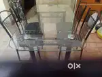 Glass dining table , easy to dismantle and assemble with 4chairs