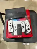 Nintendo Switch (Oled Model) with White joy con