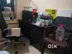 Computer table and 1 office chair and 4 plastic chairs