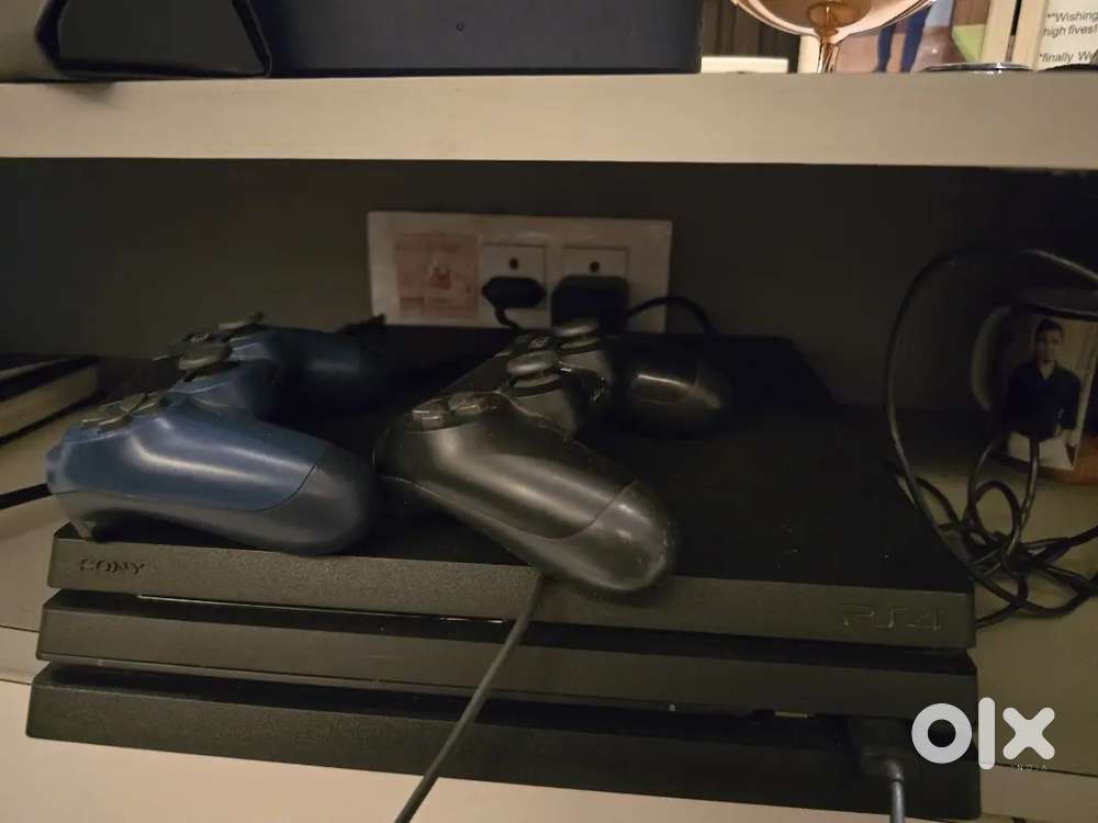 Ps 4 pro with 2 controller & 2 games Cds