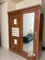 Modern wardrobe with stylish sliding door with mirror