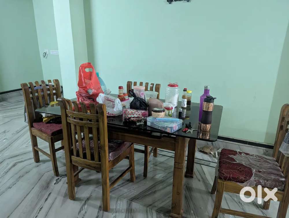 Brand new 4 seater dinning table with chairs made of segun wood