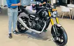 Speed 400 with accessories very less used july 2024 model black colour