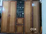 2 wardrobe attached with showcase in centre