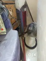 Cooler in running condition and 4 plastic chairs