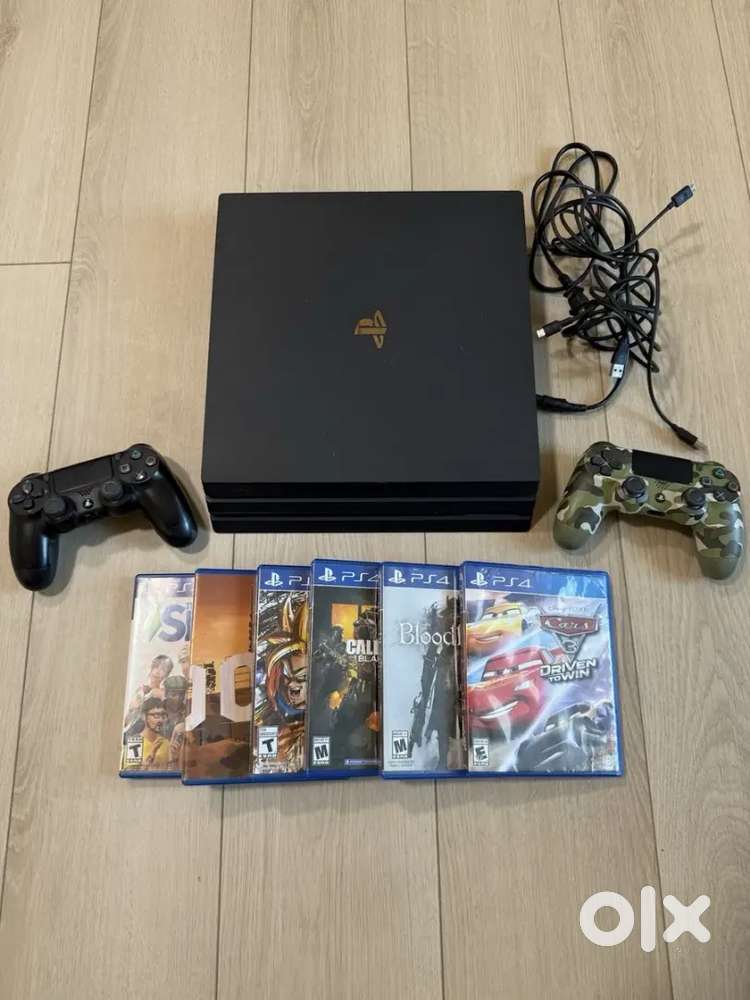 Sony PS4 Pro 1TB Console w/ 2 Controllers + 6 Games GTA V Sims