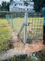 Chain link mesh fence ,slab wall and berbed wire