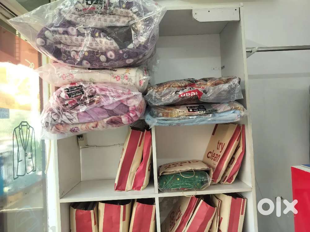 Press man and helper girl and boy need in drycleaning company