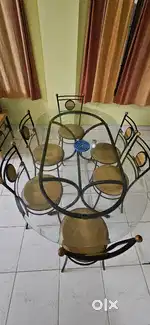 Glass top 6 seater dining table with chairs